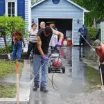 people doing after flood damage cleanup
