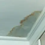 water damage sign on a ceiling